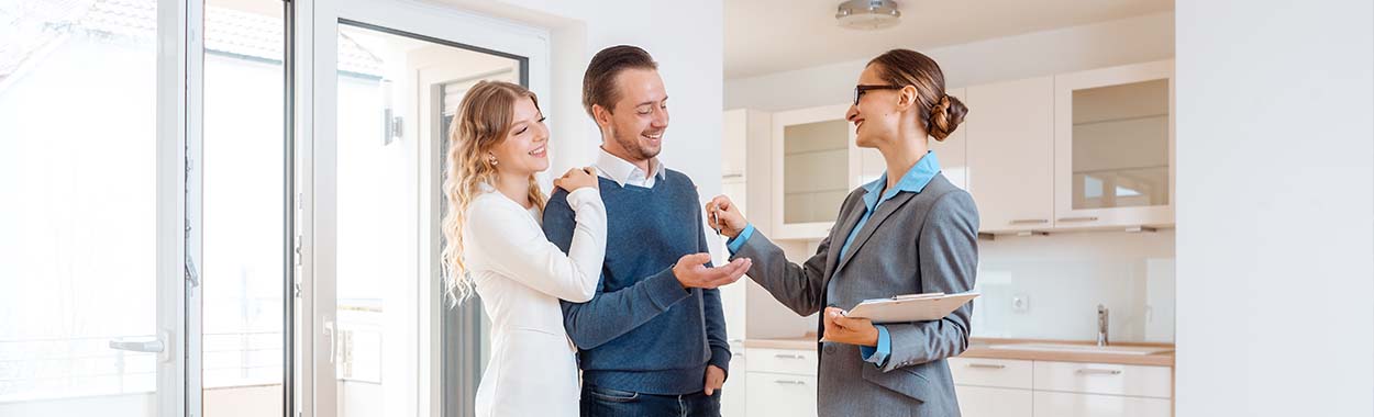 Real estate agent or property manager talking to clients
